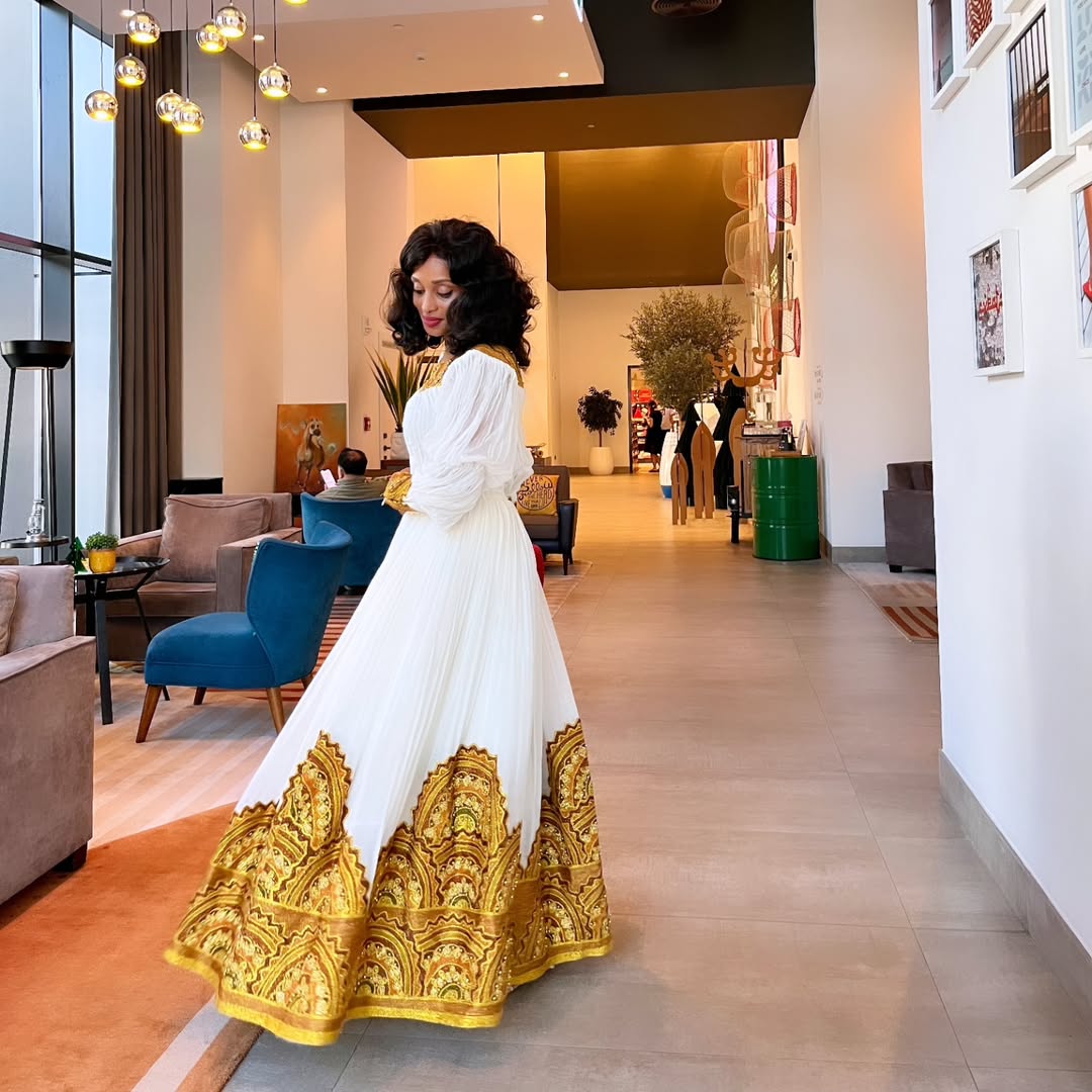 Golden Handmade Habesha Dress: Wide Hemline Embellishment on Traditional Ethiopian Dress Elegant Habesha Kemis