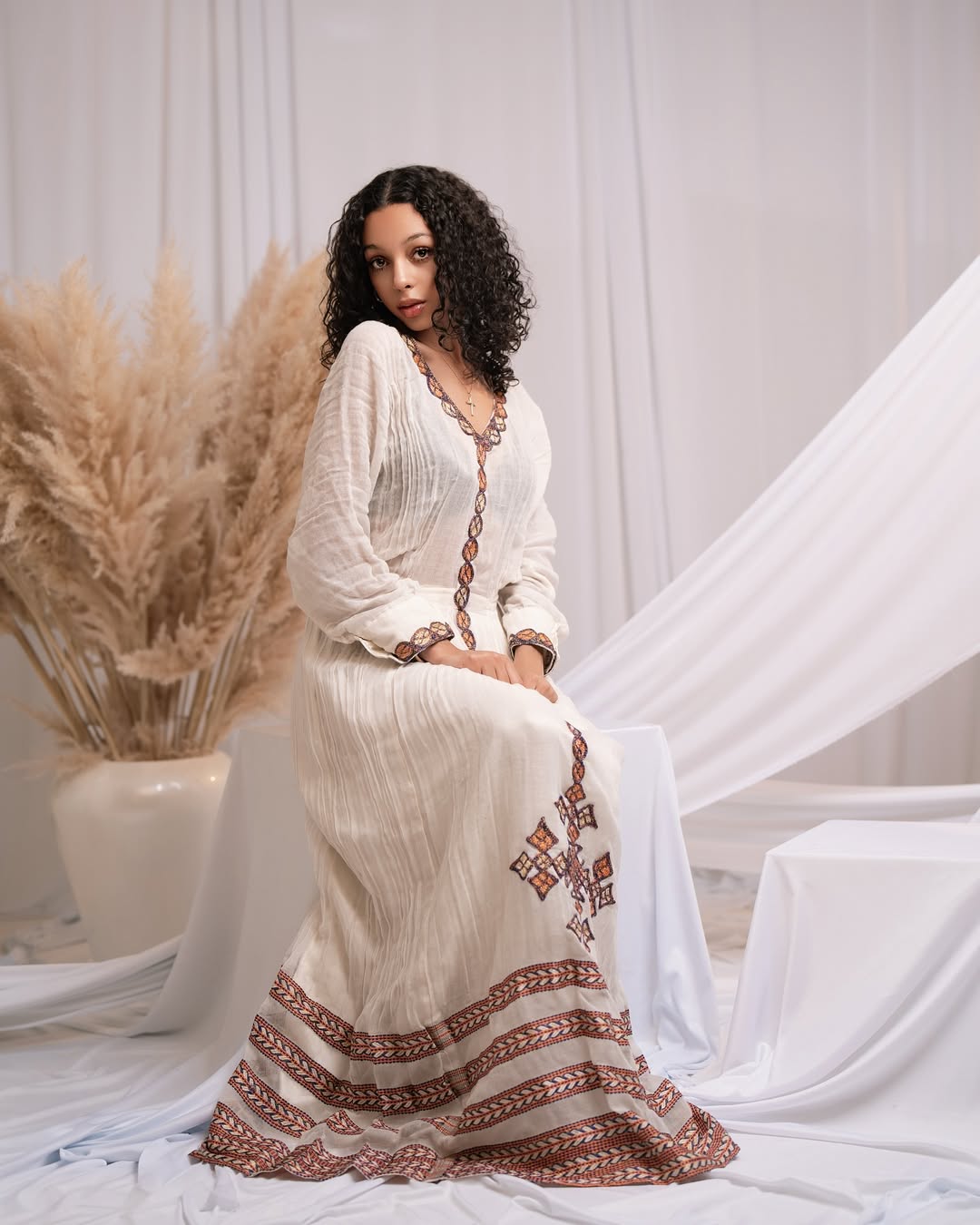 Effortless Elegance: Classic Habesha Kemis with Refined Red Detailing