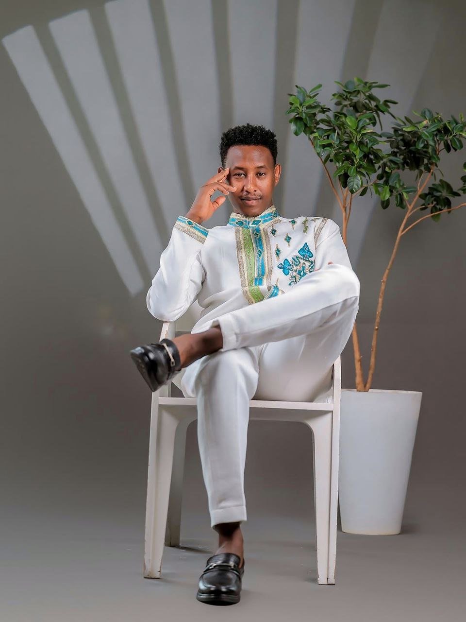 Elegant Ethiopian Men’s Outfit with Blue and Green Cross Motifs for Celebrations Includes Shirt and Pants