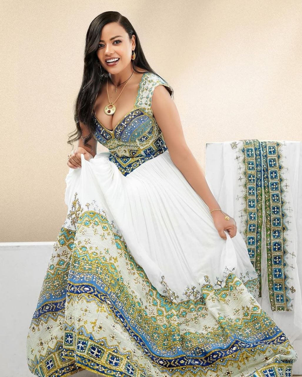 Elegant Habesha Kemis with Gold, Green and Sea Blue Details for Wedding and Events