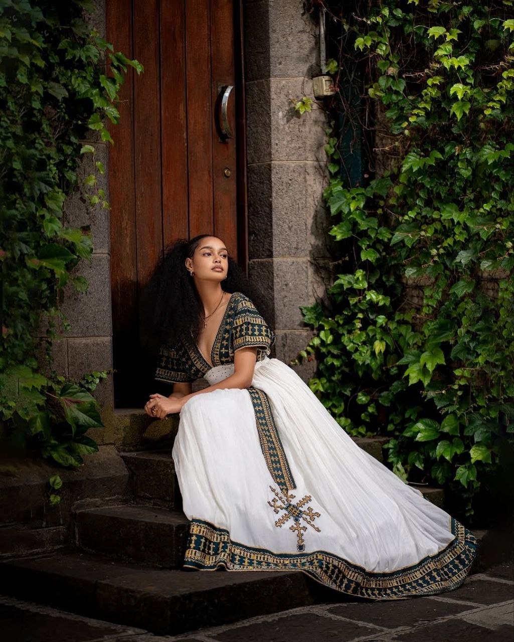Elegant Traditional Ethiopian Dress with Rich Black and Gold Embroidery for Cultural Celebrations