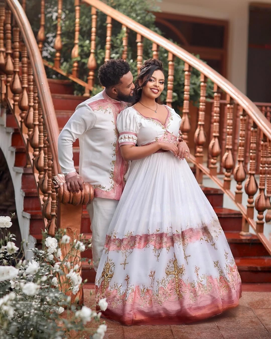 Glamorous Light Pink Habesha Wedding Outfit with Matching Couple Design