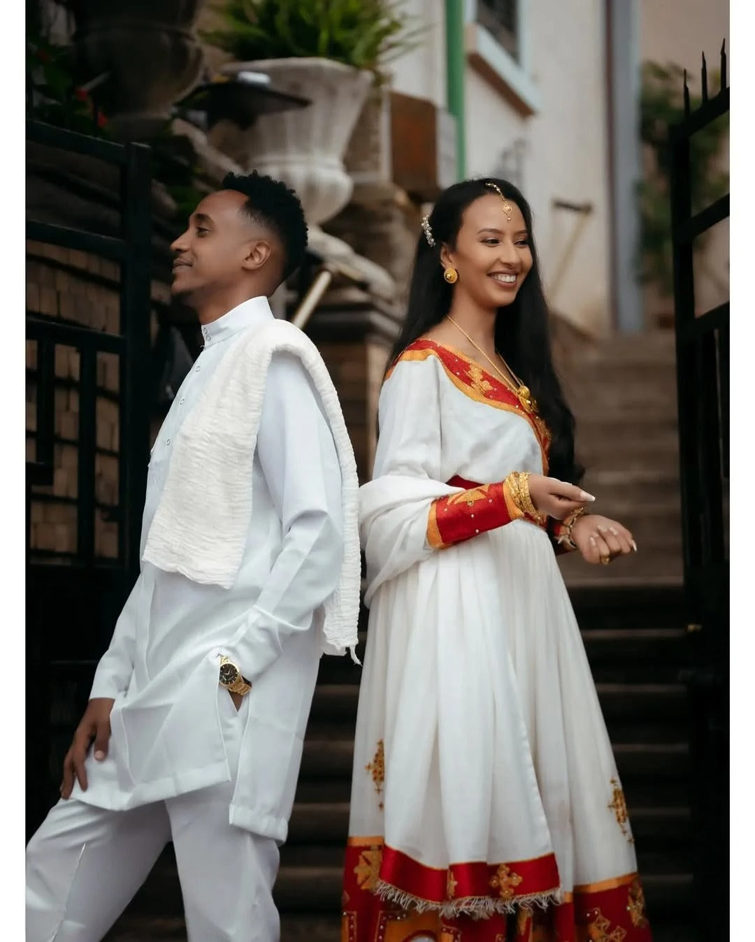 Vibrant Red Habesha Wedding Couples Outfits: Golden Cultural Embroidery Matching Ethiopian Couples Wedding Attire