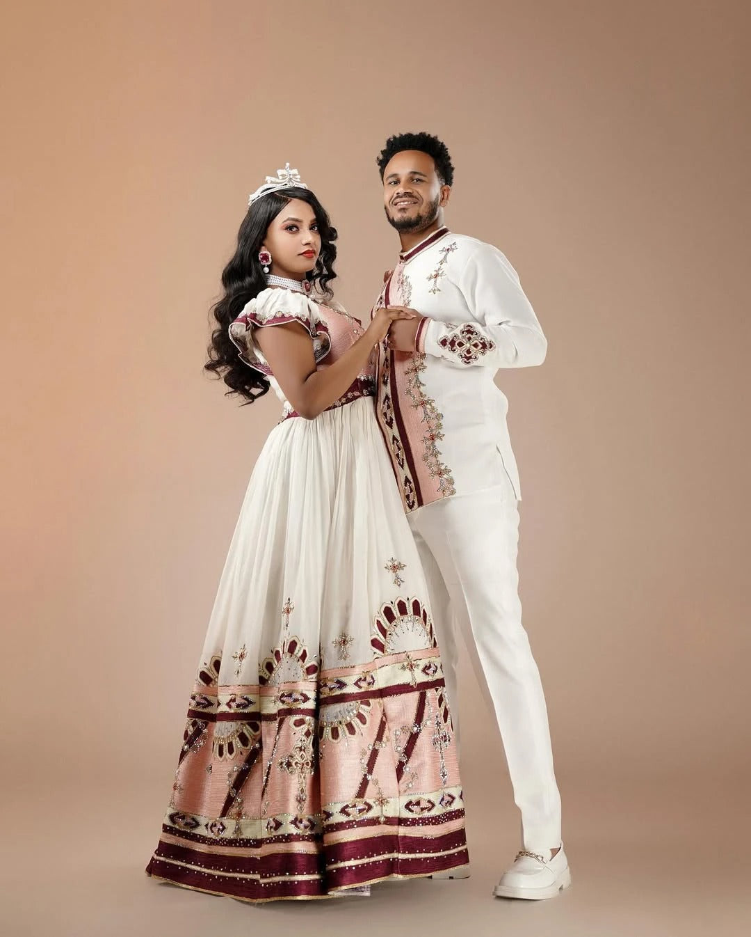 Fashionable Pink Ethiopian Wedding Outfit: with Brown and Silver Detailing Matching Habesha Couples Outfits Attire