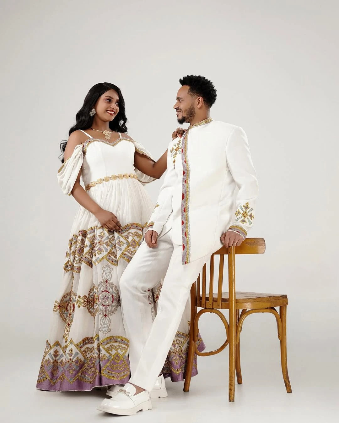 Flawless Shimmering Habesha Couples Outfits: Colorful Beaded Matching Ethiopian Wedding Outfit