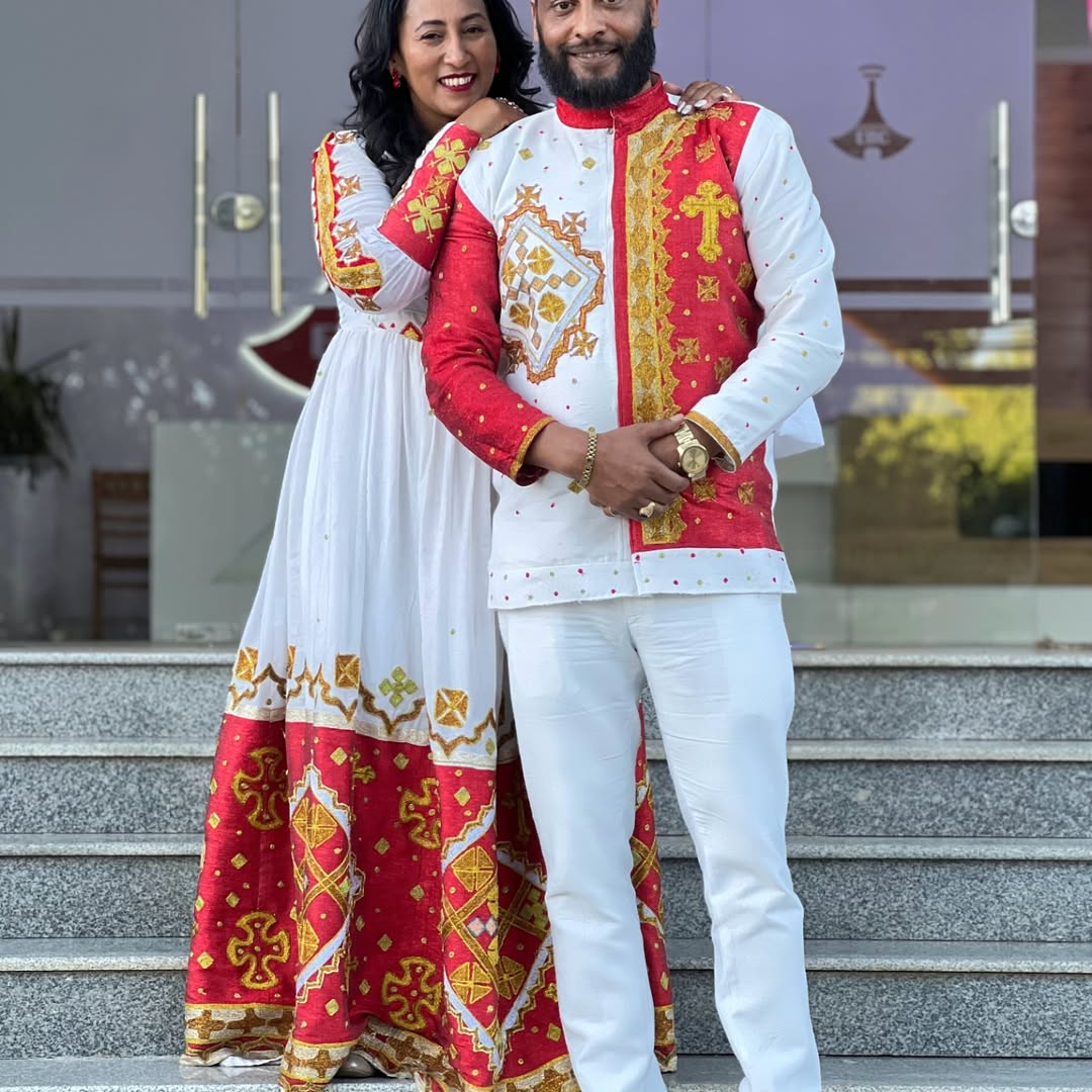 Celebrating Love in Red Habesha Couples Outfit: Golden Detailing on Matching Ethiopian Couples Wedding Attire