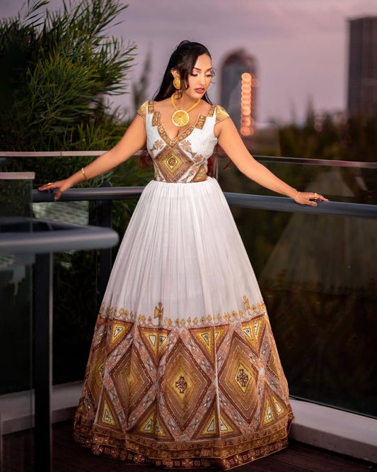 Elegant White Habesha Bridal Dress with Gold & Brown Patterns – Ethiopian Wedding Dress