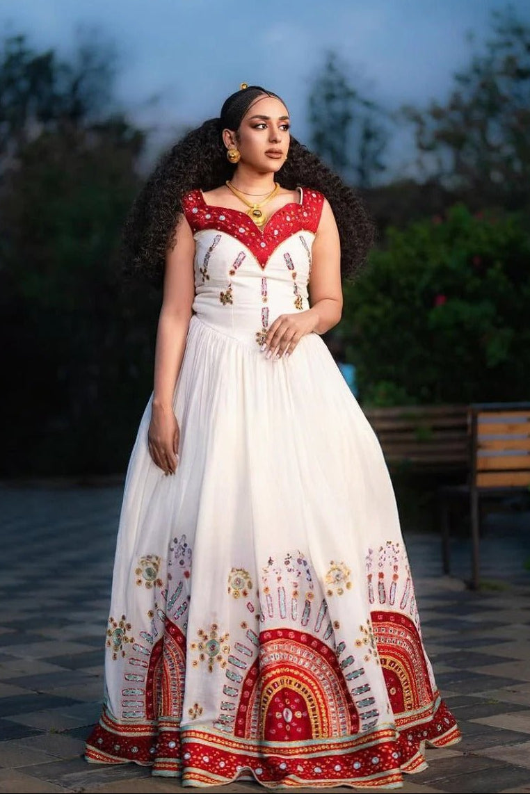 Elegant Habesha Dress with Vibrant Red and Gold Embroidery for Weddings