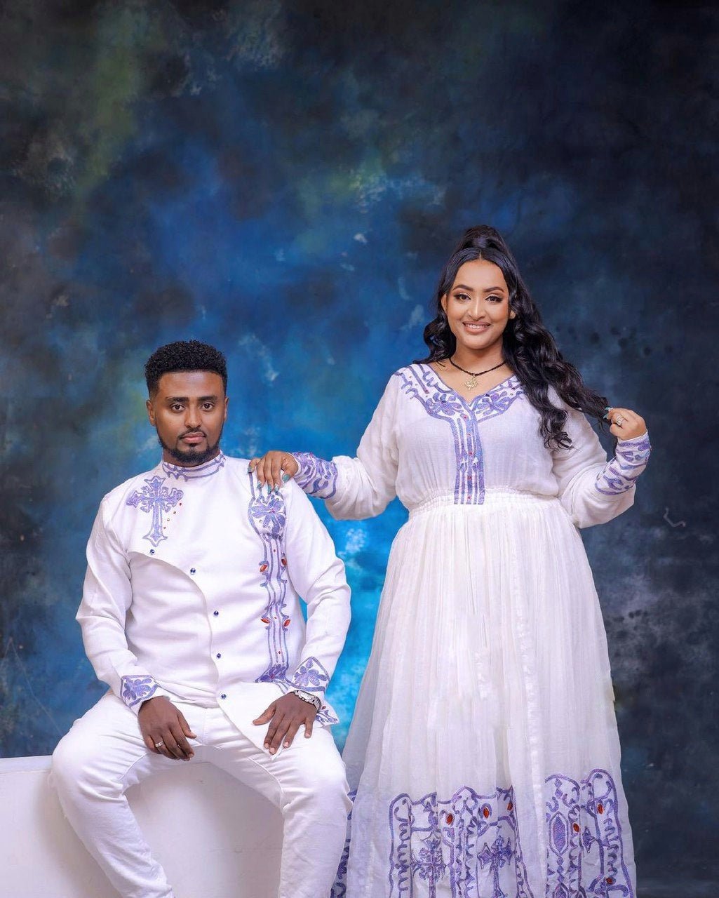 Blue Design Habesha Couples' Outfits in Ethereal Light Hues