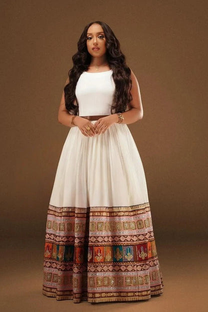 Elegant Sleeveless Habesha Dress with Vibrant Tilf: A Modern Ethiopian Dress
