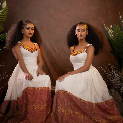 Elegant Habesha Kemis with Vibrant Red And Yellow Embroidery for Special Occasions
