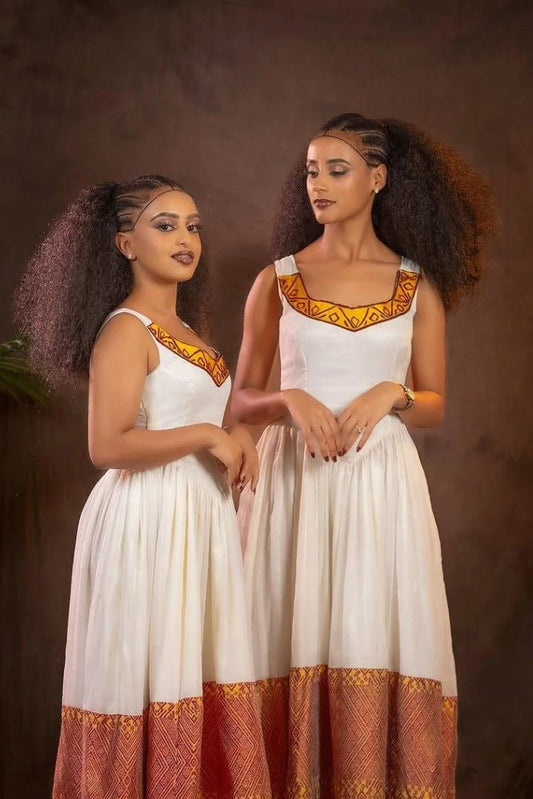 Elegant Habesha Kemis with Vibrant Red And Yellow Embroidery for Special Occasions