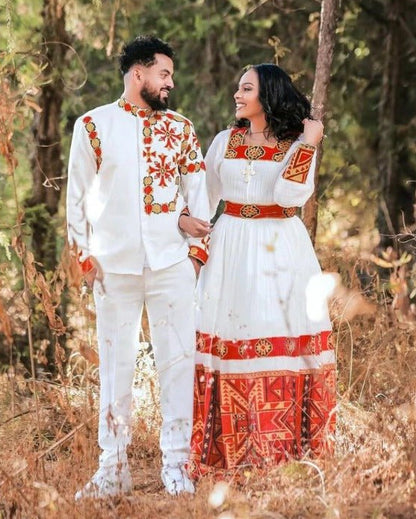 Elegant Habesha Wedding Couple’s Outfit with Rich Red and Gold Embroidery for Your Special Day
