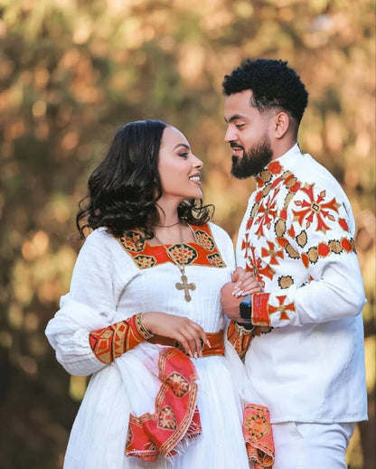 Elegant Habesha Wedding Couple’s Outfit with Rich Red and Gold Embroidery for Your Special Day