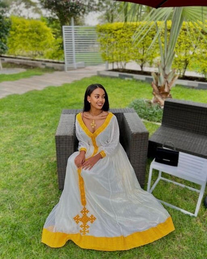 A Vibrant Yellow Tilf Habesha Dress