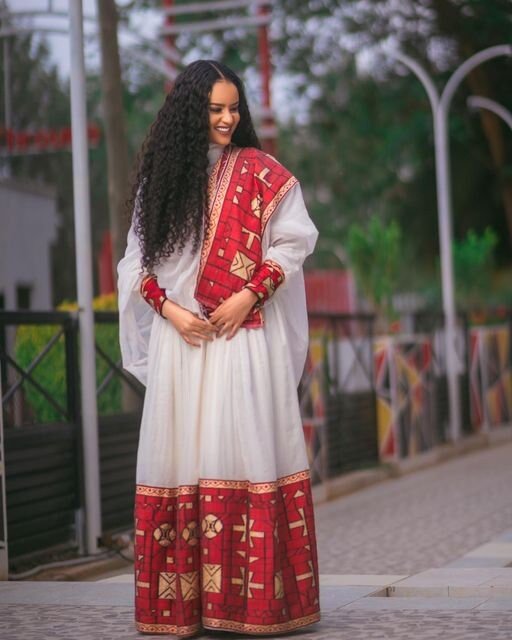 A Luxurious Menen Fabric Habesha Kemis in Red