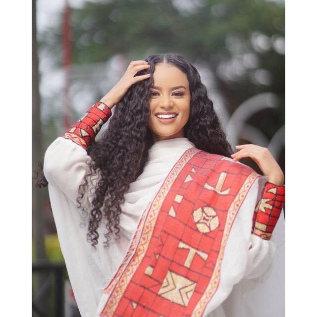 A Luxurious Menen Fabric Habesha Kemis in Red