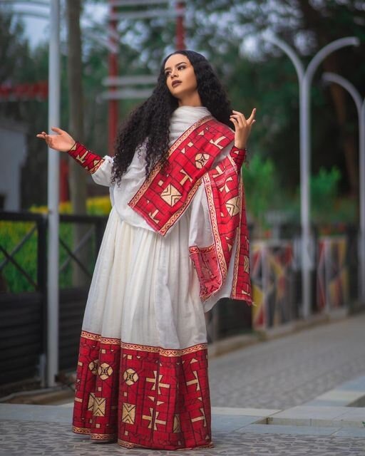 A Luxurious Menen Fabric Habesha Kemis in Red