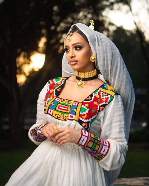 Breathtaking Habesha dress made of Menen fabric with a colorful pattern Tilf design