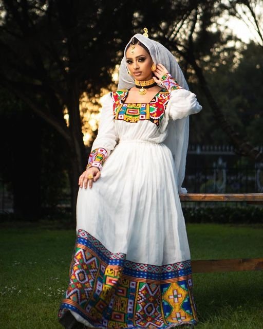 Breathtaking Habesha dress made of Menen fabric with a colorful pattern Tilf design