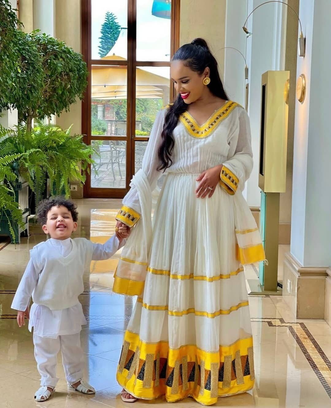 Vibrant yellow habesha dress simplicity in Ethiopian dress