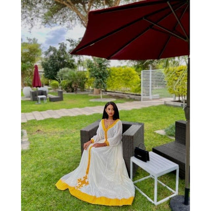 A Vibrant Yellow Tilf Habesha Dress