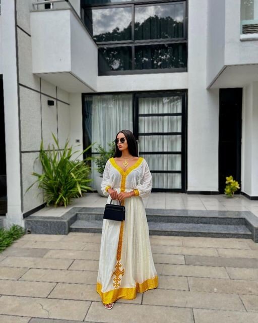 A Vibrant Yellow Tilf Habesha Dress