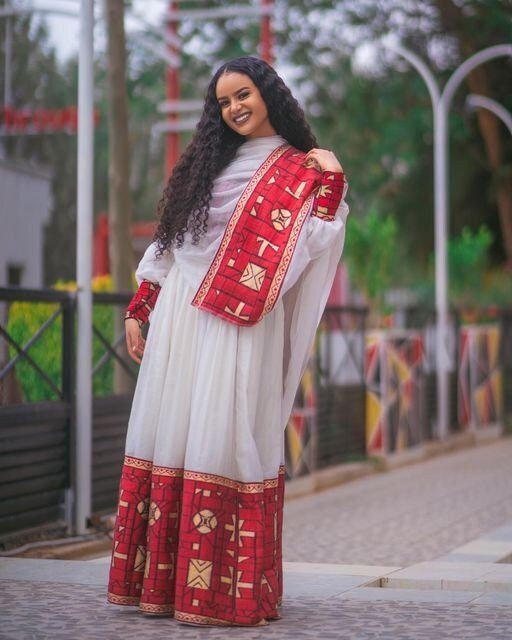 A Luxurious Menen Fabric Habesha Kemis in Red