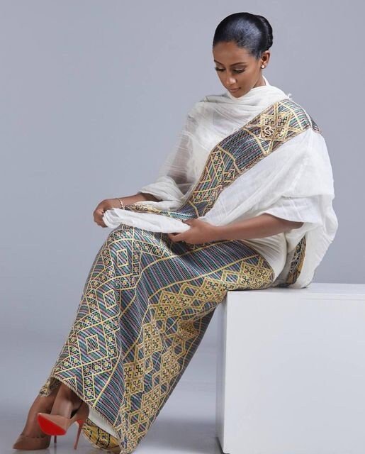 A Masterpiece of Traditional Elegance: Shimena Habesha Dress with Intricate Pattern and Tibeb Design, Habesha dress, Habesha kemis, ሀበሻ