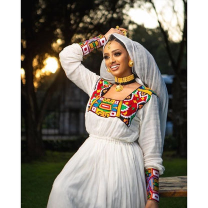 Breathtaking Habesha dress made of Menen fabric with a colorful pattern Tilf design