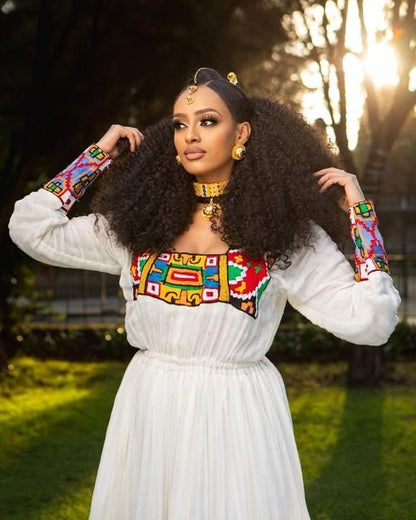 Breathtaking Habesha dress made of Menen fabric with a colorful pattern Tilf design