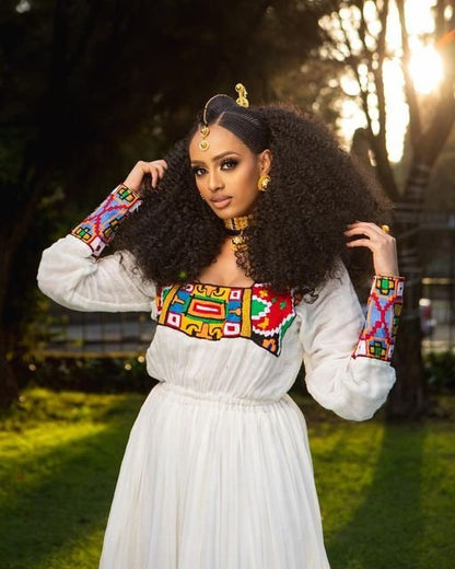 Breathtaking Habesha dress made of Menen fabric with a colorful pattern Tilf design