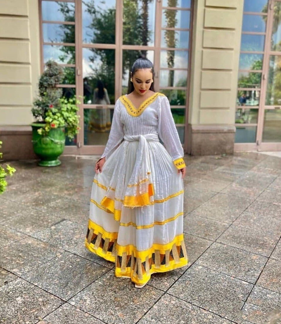 Vibrant yellow habesha dress simplicity in Ethiopian dress