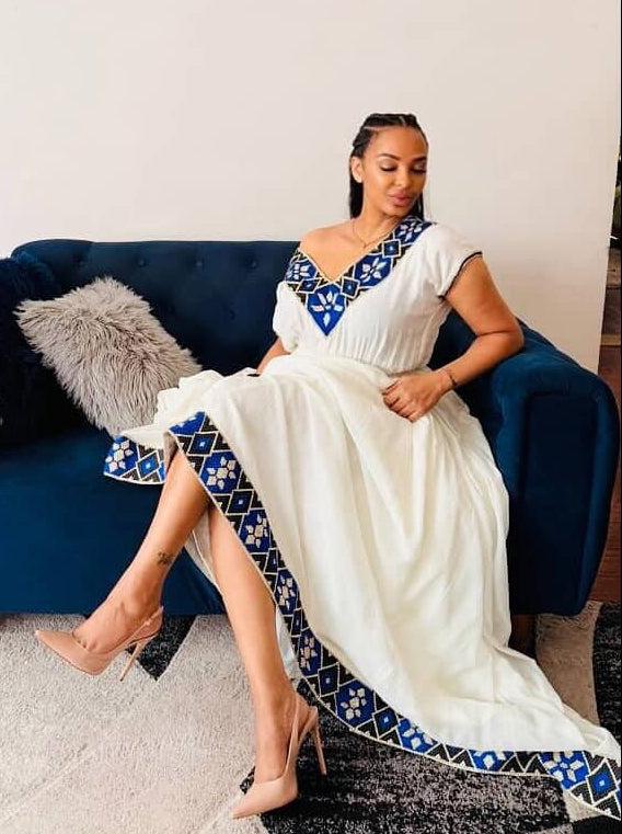 stylish ethiopian dress with blue embroidery on habesha cloth