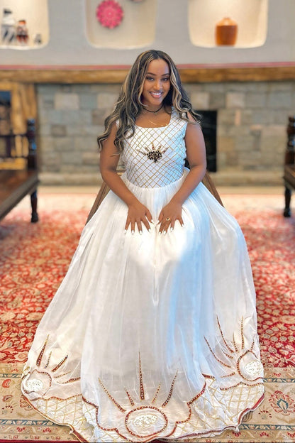 White Habesha Kemis with Elegant Gold Embroidered Detail