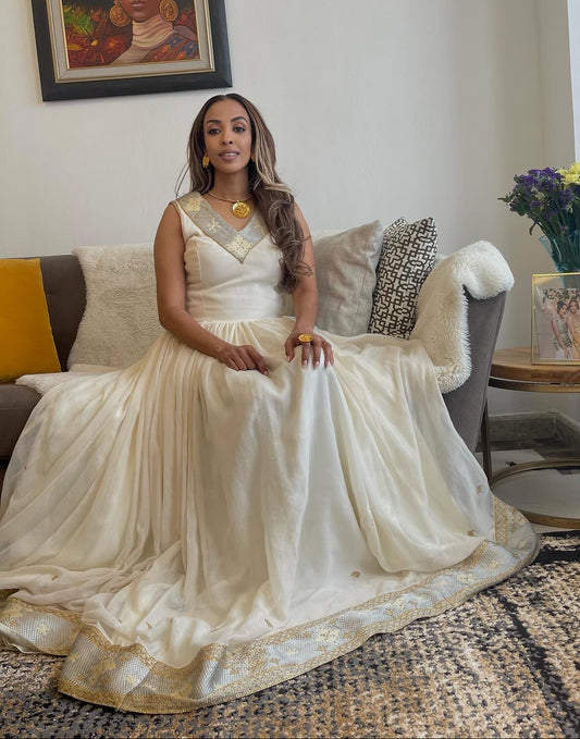 White Sleeveless Habesha Kemis with Gold Embroidery