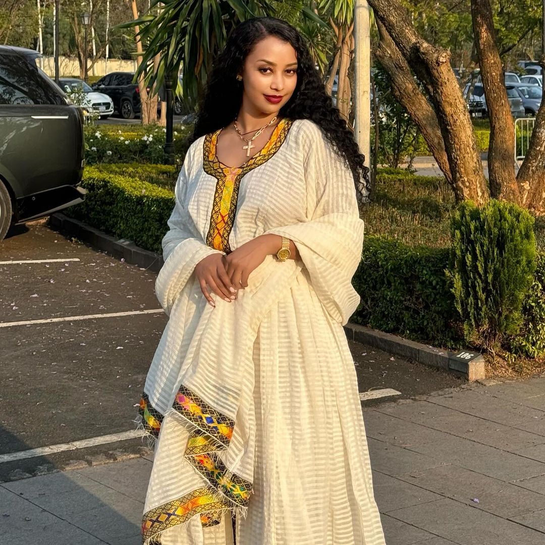 Vibrant Simplicity: Menen Fabric Habesha Kemis in Ethereal Hues Habesha Kemis