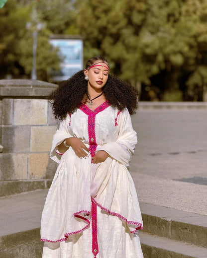 Elegance in Pink: Handwoven Fetil Fabric and Cotton Blend Habesha Kemis - A Stunning Ethiopian Dress