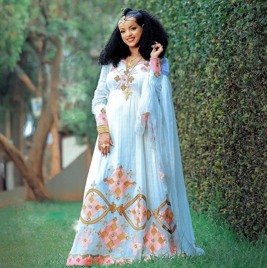 Radiant Splendor: Vibrant Pink Habesha Kemis Embodied in Ethiopian Elegance