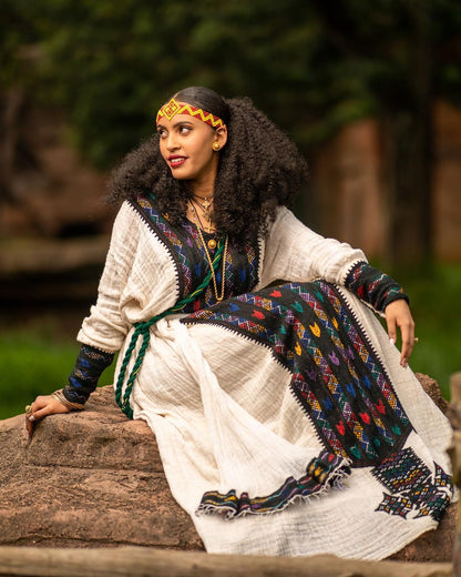 Cultural Splendor: Ethiopian Habesha Kemis adorned with Dark Tilet Design