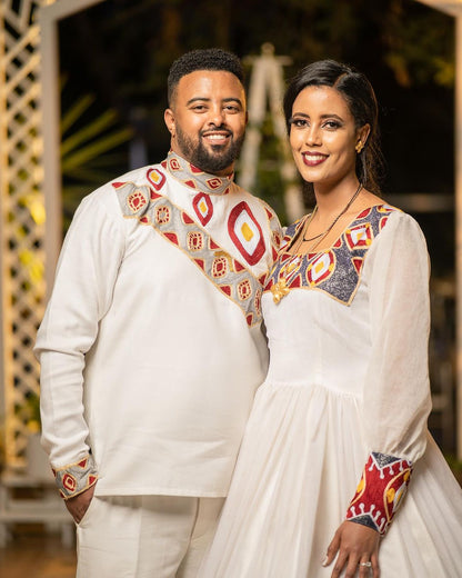 Ethereal Elegance: The Majestic Habesha Wedding Ensemble Habesha Couples Outfit