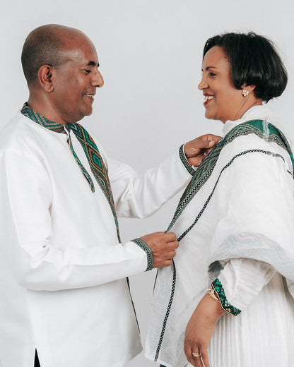 "Enchanting Habesha Wedding Attire: Ethiopian Couples' Resplendent Green-Patterned Elegance