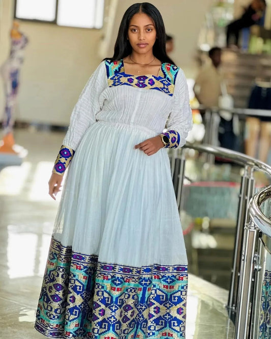 Azure Elegance Habesha kemis Contemporary Interpretations of Habesha Dress with Vibrant Blue Detailing