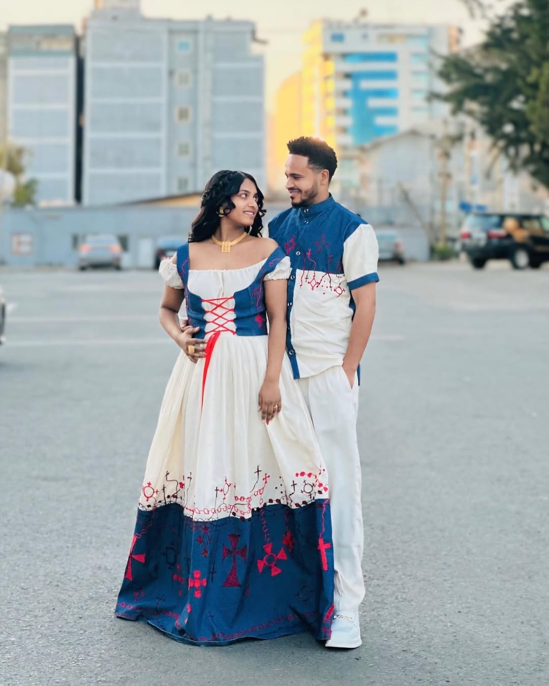 Sophisticated Red and Blue Habesha Couples Outfit