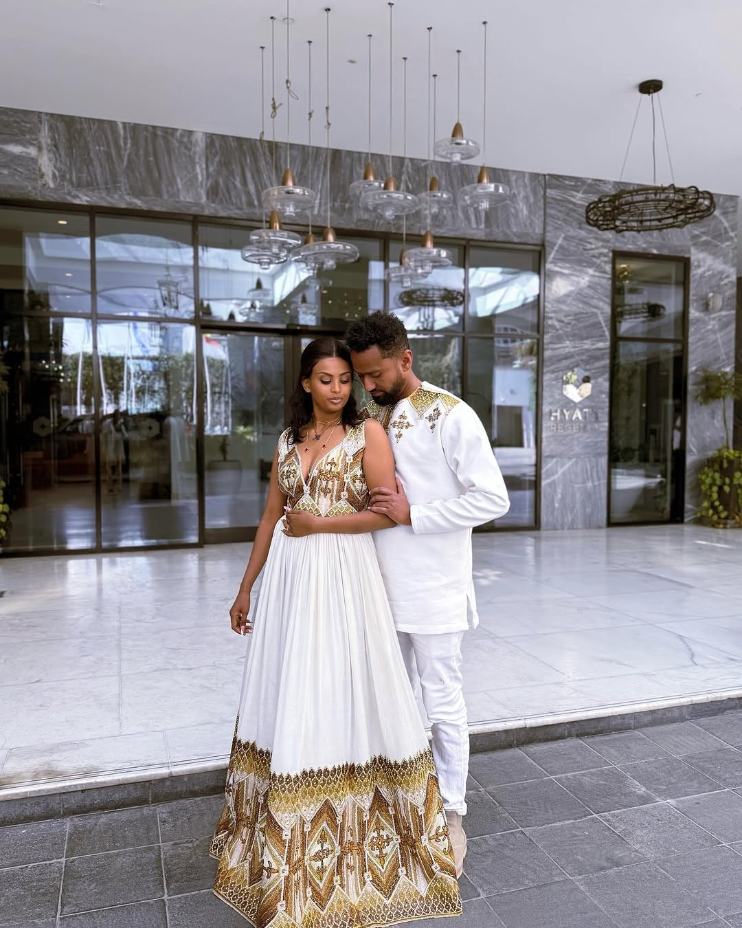 Beautiful Union in Golden Habesha Couples Outfit: Excellent Embellishment in Matching Ethiopian Couples Attire