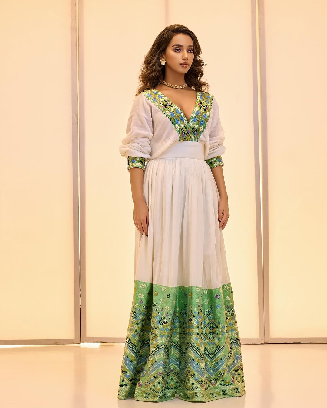 Luxurious Look with Emerald Green Habesha Dress: Multicolored Embellishments on Traditional Ethiopian Cloth Intricately Designed Eritrean Dress