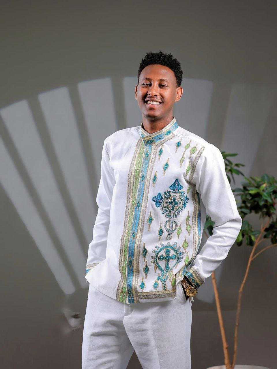 Elegant Ethiopian Men’s Outfit with Blue and Green Cross Motifs for Celebrations Includes Shirt and Pants