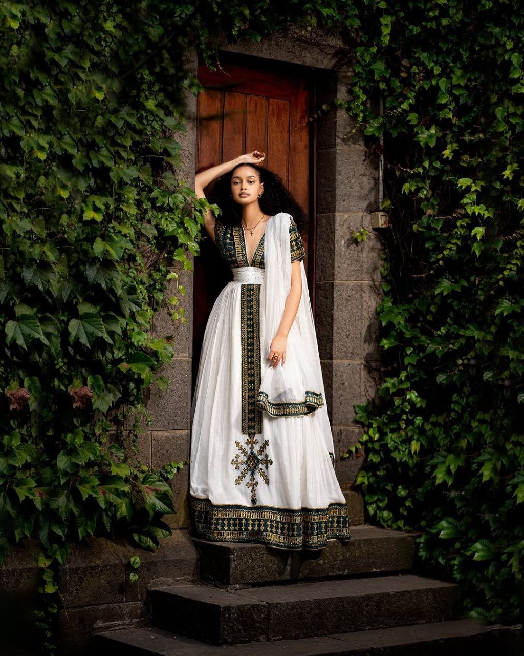 Elegant Traditional Ethiopian Dress with Rich Black and Gold Embroidery for Cultural Celebrations