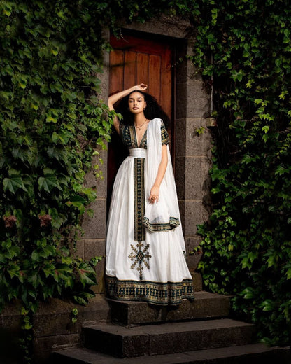 Elegant Traditional Ethiopian Dress with Rich Black and Gold Embroidery for Cultural Celebrations