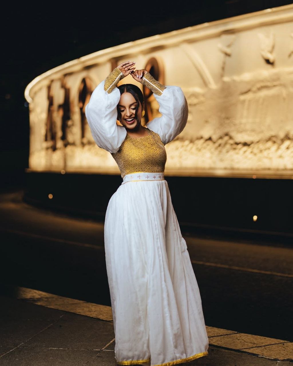 Vibrant Gold Bodice Habesha Dress with Flowing Skirt for an event
